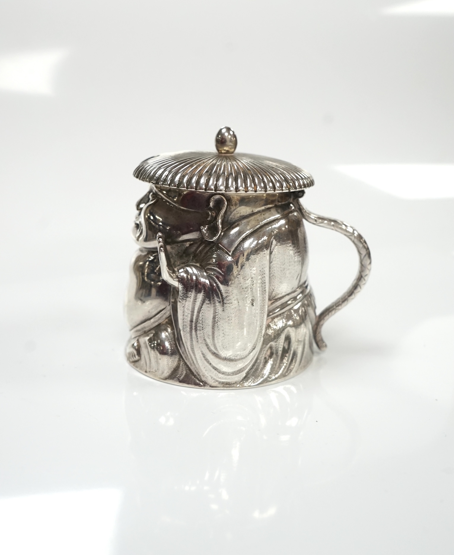 A Victorian novelty silver mustard, modelled as a Chinaman, with blue glass liner, by Richard Sibley II, London, 1847, height 85mm, 6.1oz. Condition - fair